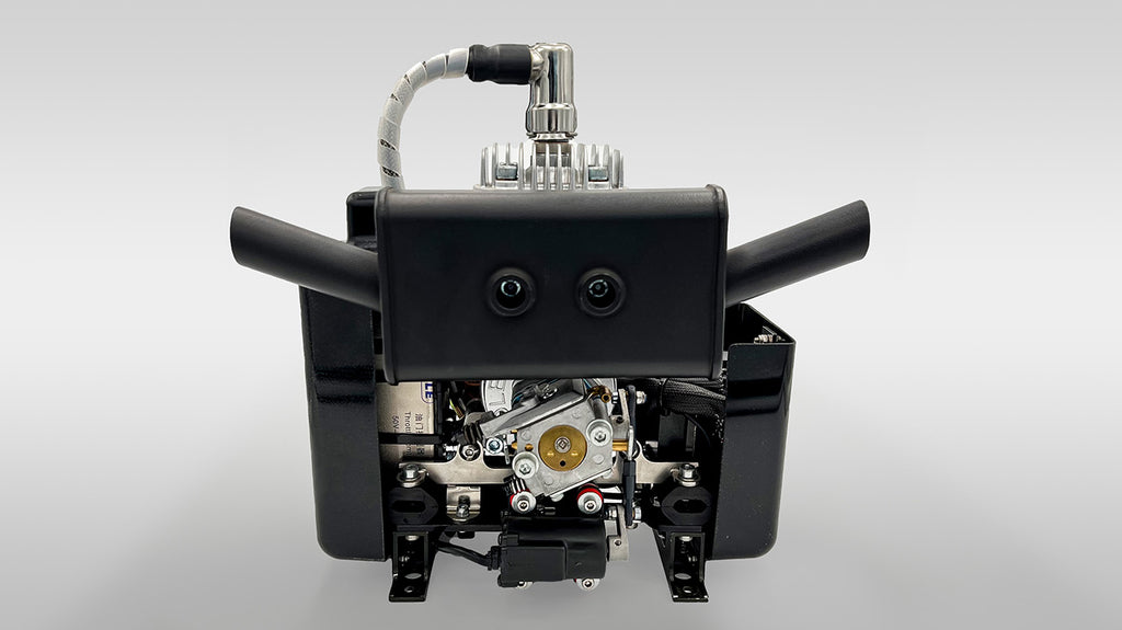 Close-up of DLE35HD engine with visible components on a gray background