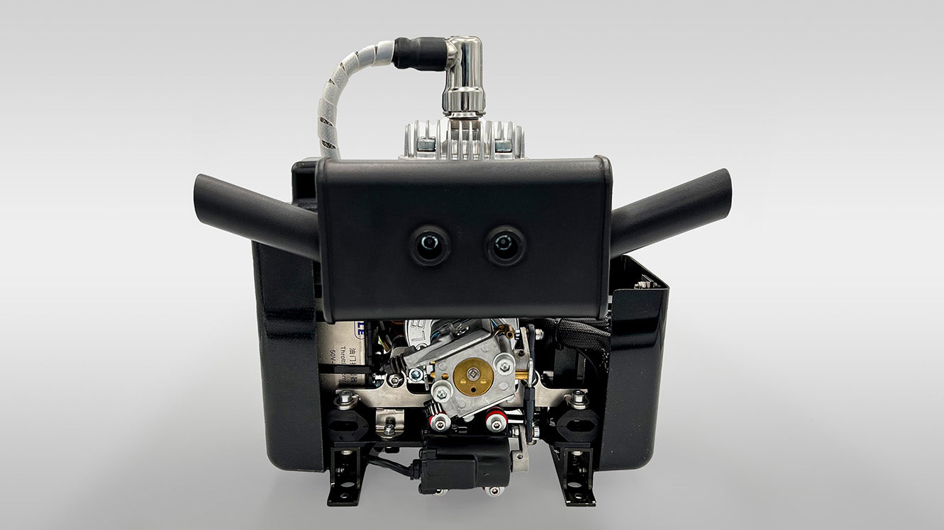 Close-up of DLE35HD engine with visible components on a gray background