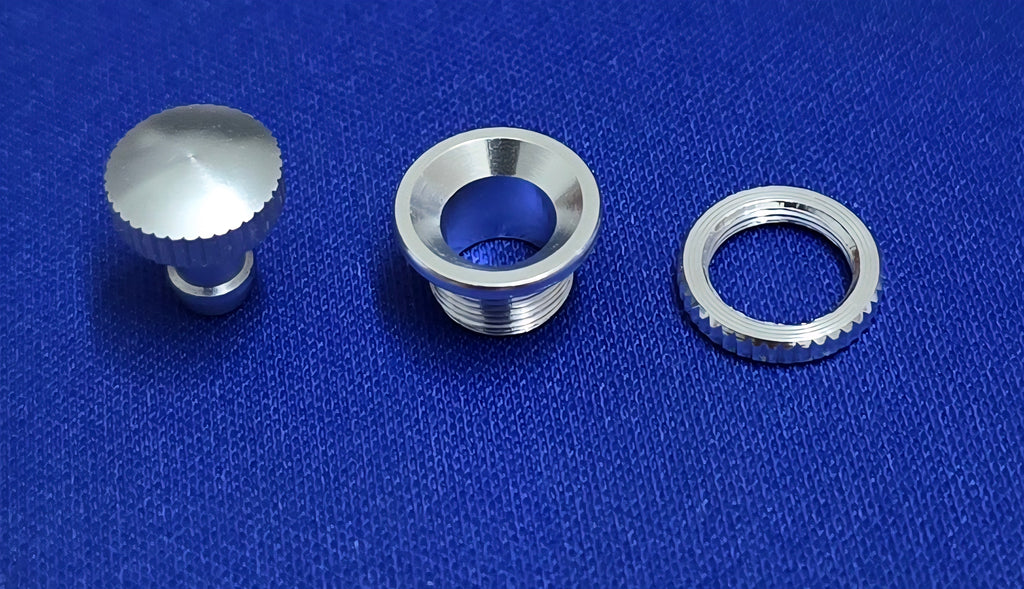 Three metallic components of Fuel Dot AeroNautical on a blue textured background.