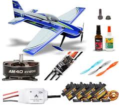 Collection of RC airplane parts including a model airplane, motors, and batteries on a white background.