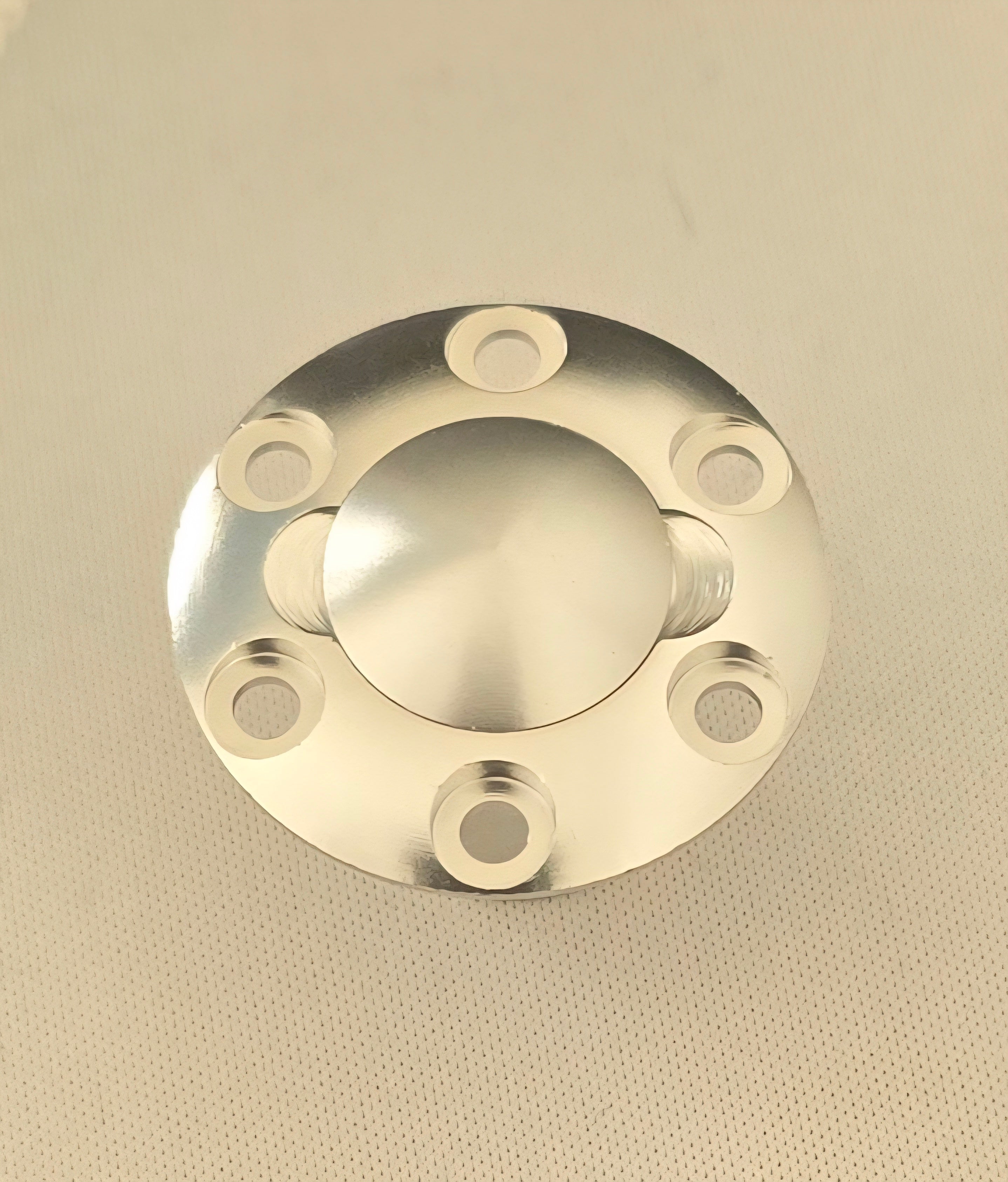 Metallic flange on a beige background