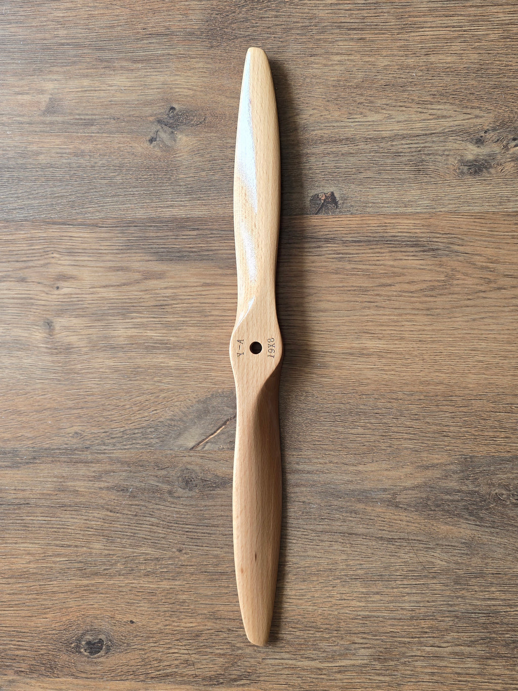 Wooden propeller on a wooden surface