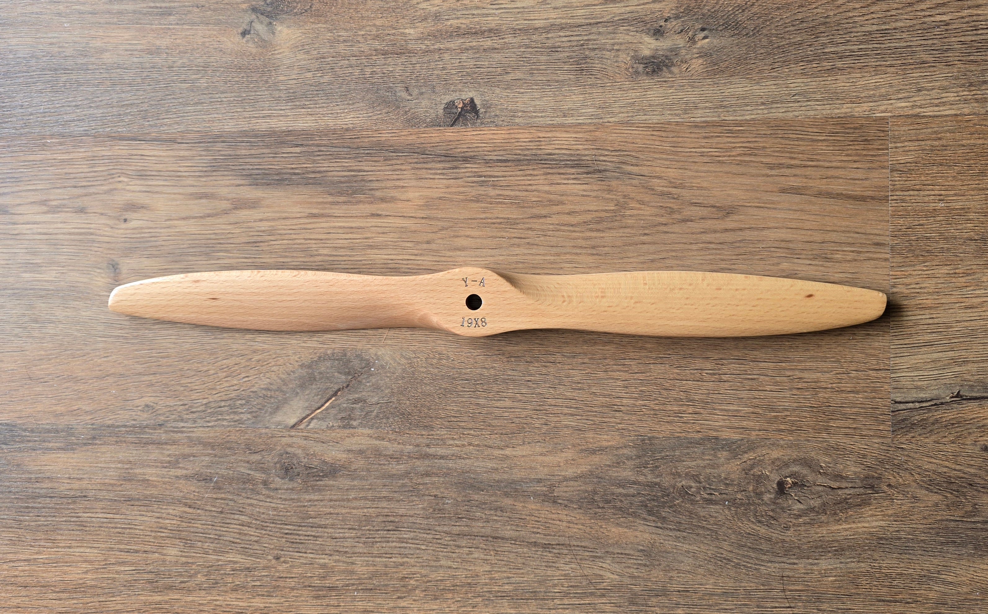 Wooden propeller on a wooden surface