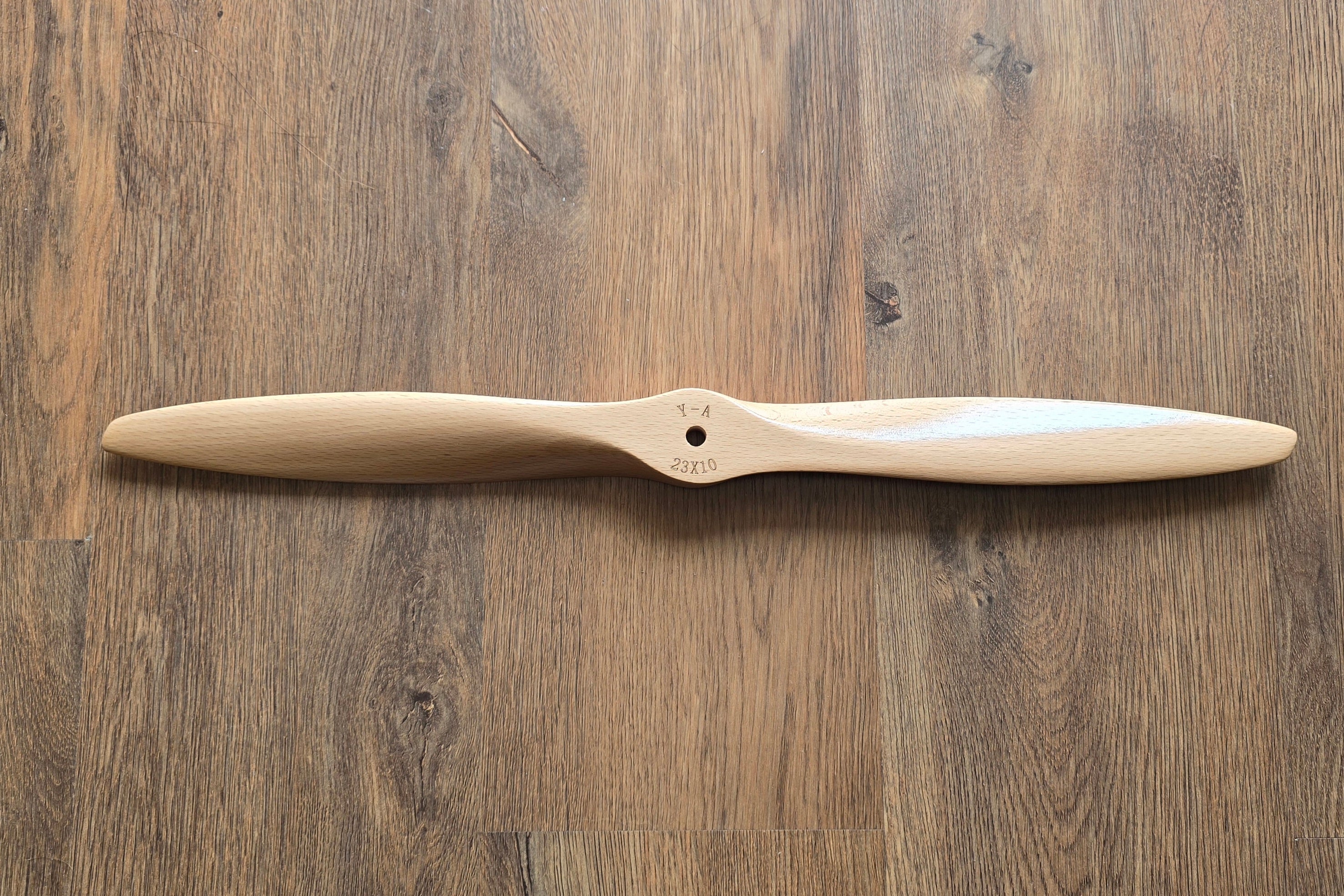 Wooden propeller on a wooden surface