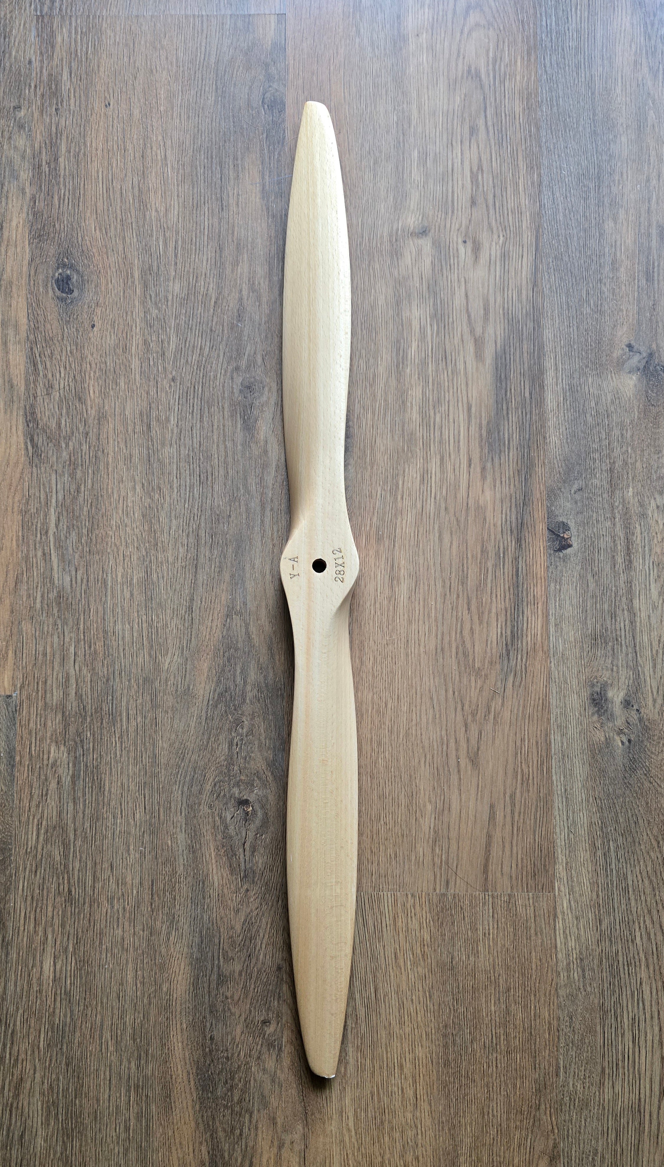 Wooden propeller on a wooden surface