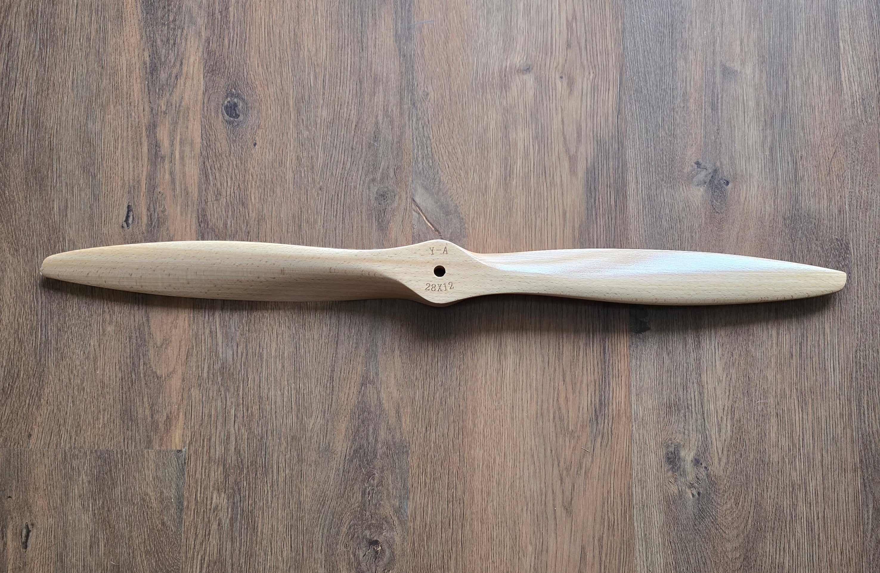 Wooden propeller on a wooden surface