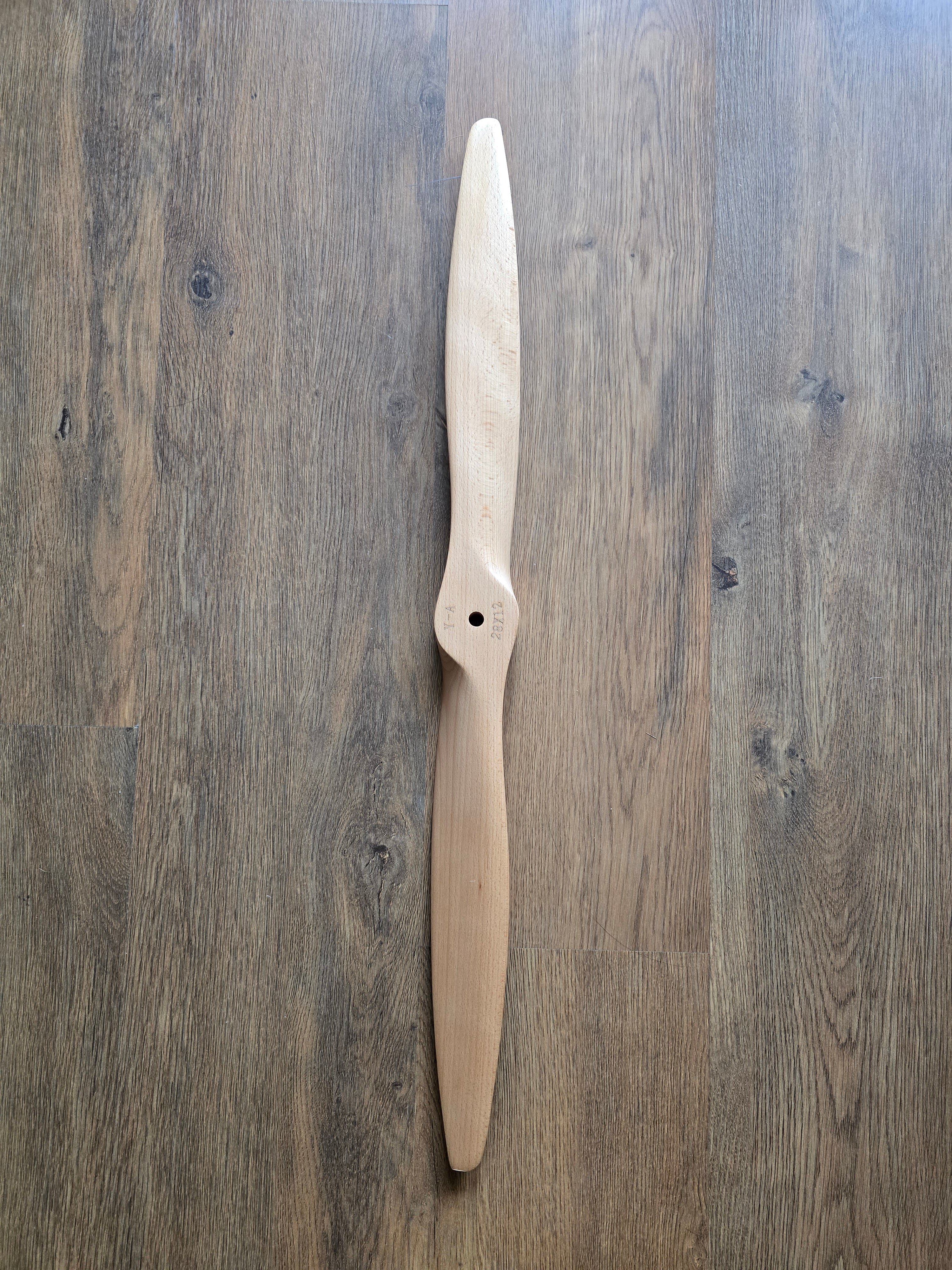 Wooden propeller on a wooden surface