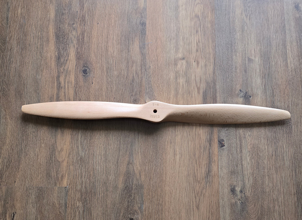 Wooden propeller on a wooden surface