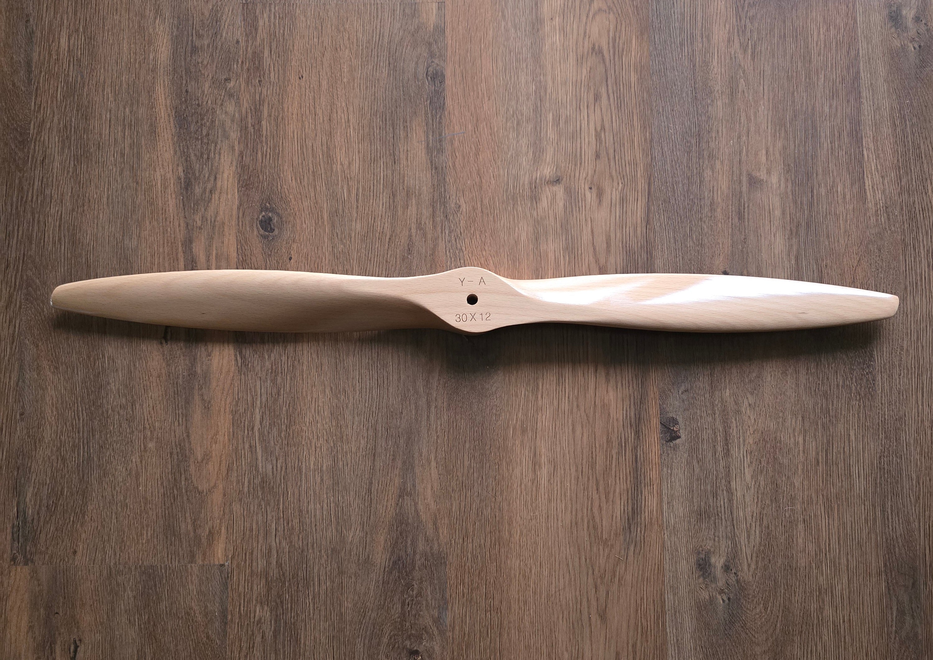 Wooden propeller on a wooden background