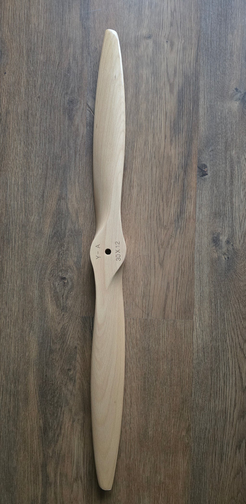 Wooden propeller on a wooden surface