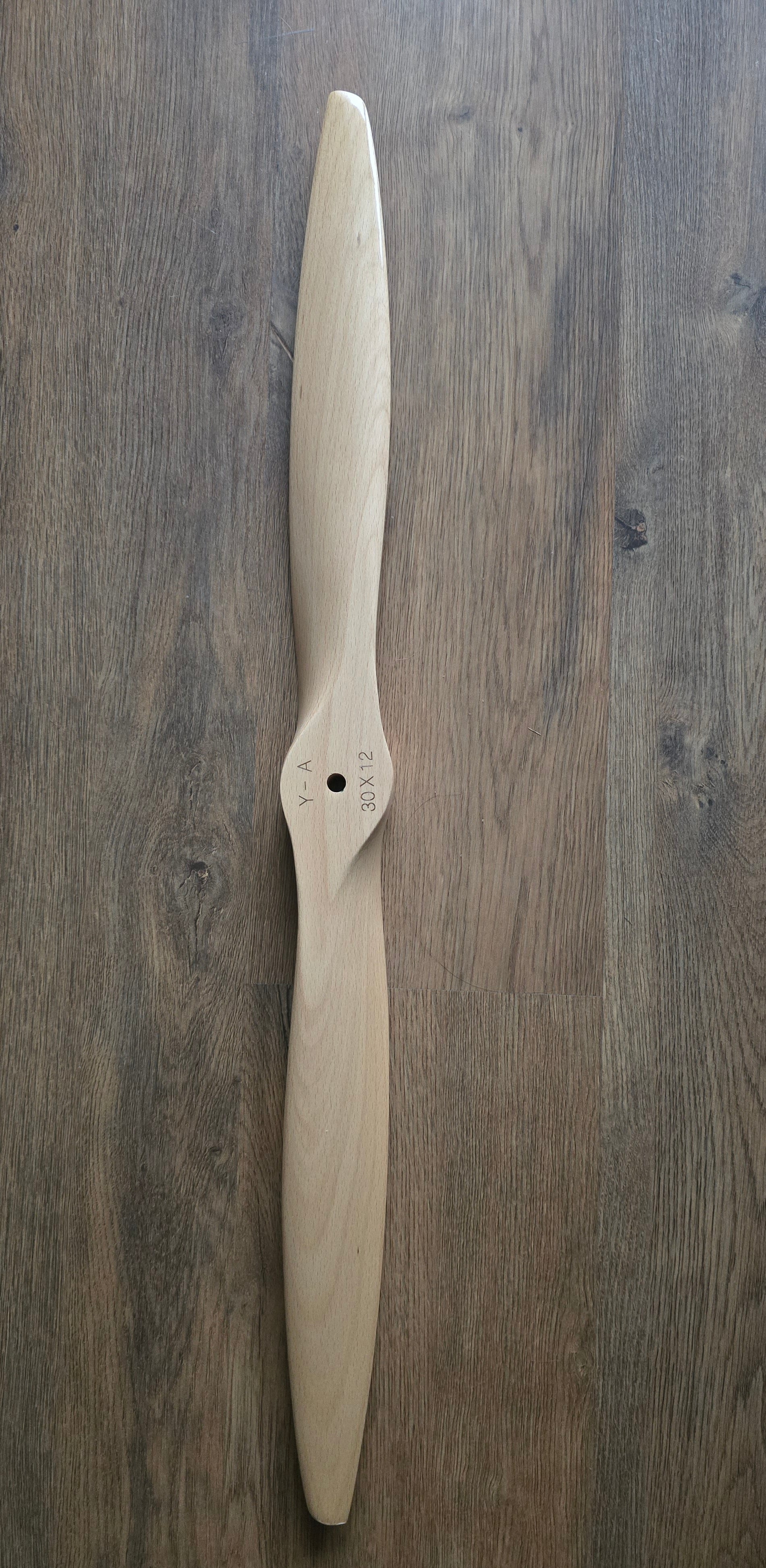 Wooden propeller on a wooden surface