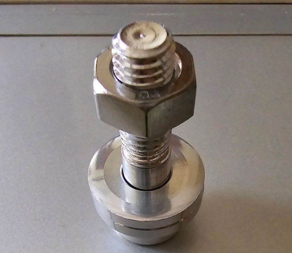 Metal fitting on a gray background