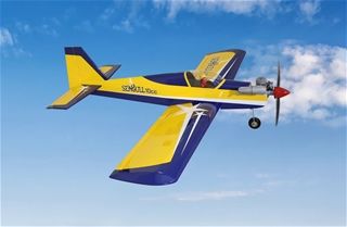 Model airplane with a blue and yellow design flying against a clear blue sky.
