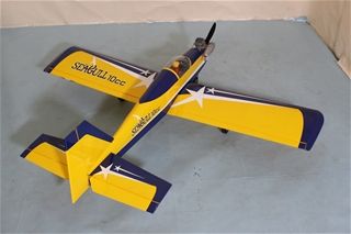 Yellow and blue model airplane on a gray surface