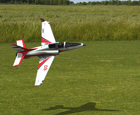 RC jet model airplane flying low over field