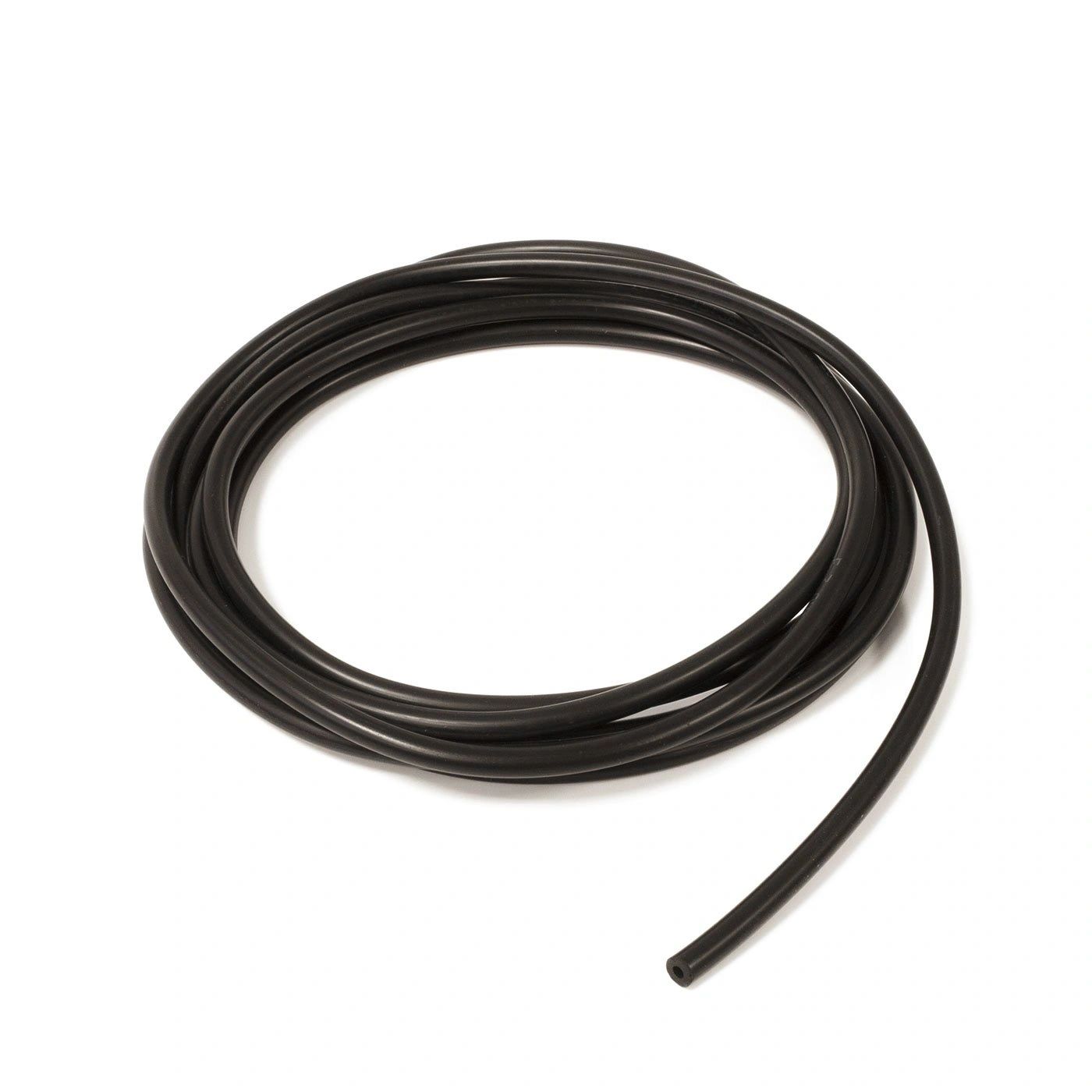 Coiled black tube on a white background