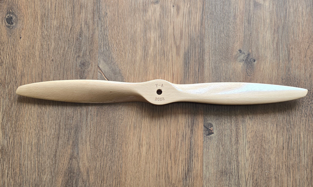 Wooden propeller on a wooden surface