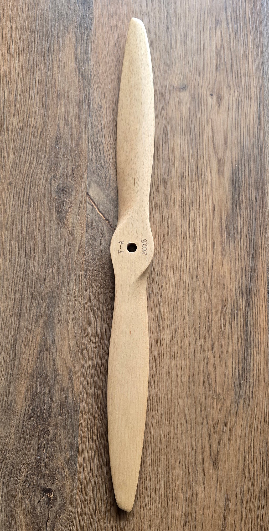Wooden propeller on a wooden surface