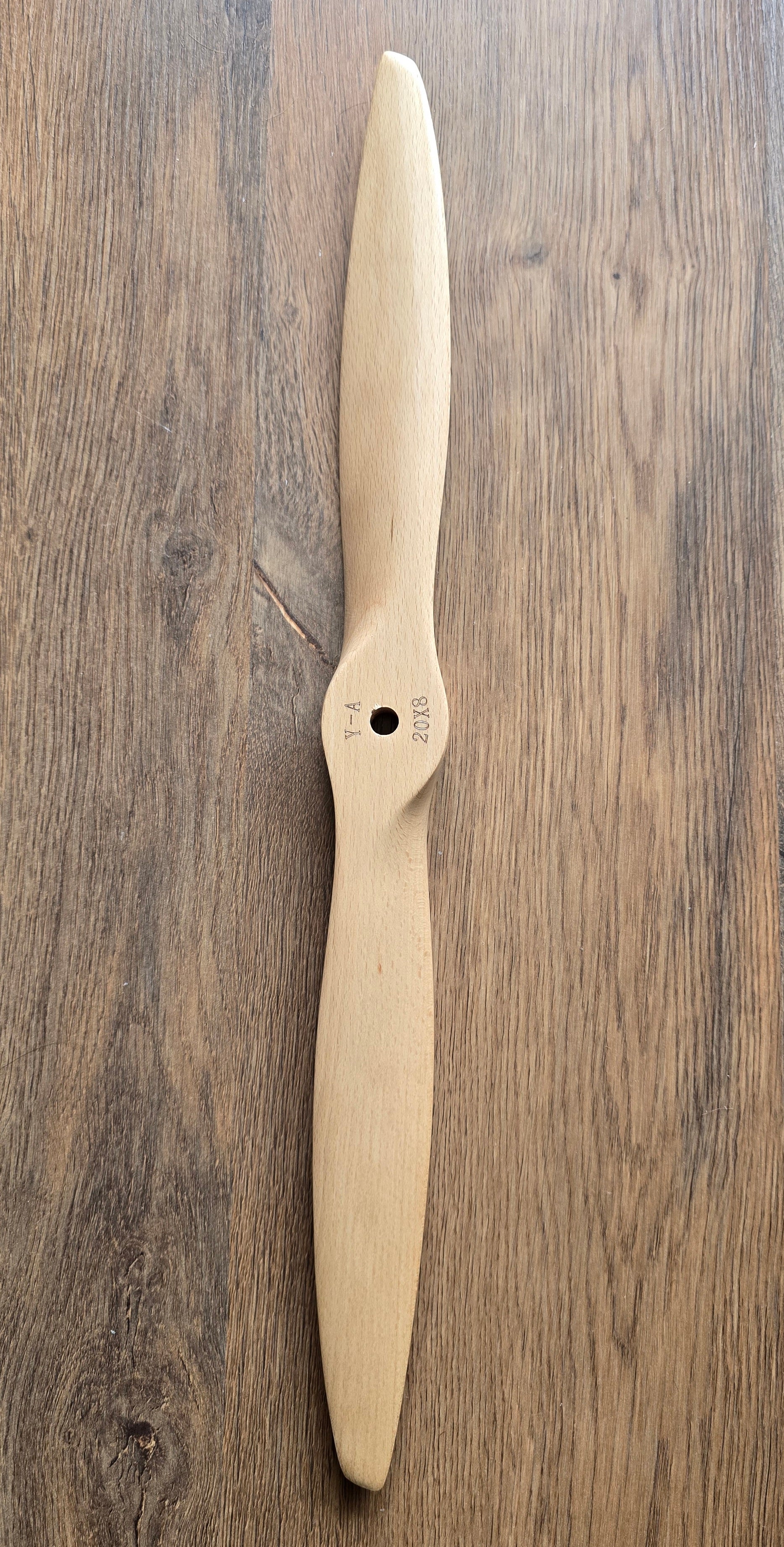Wooden propeller on a wooden surface