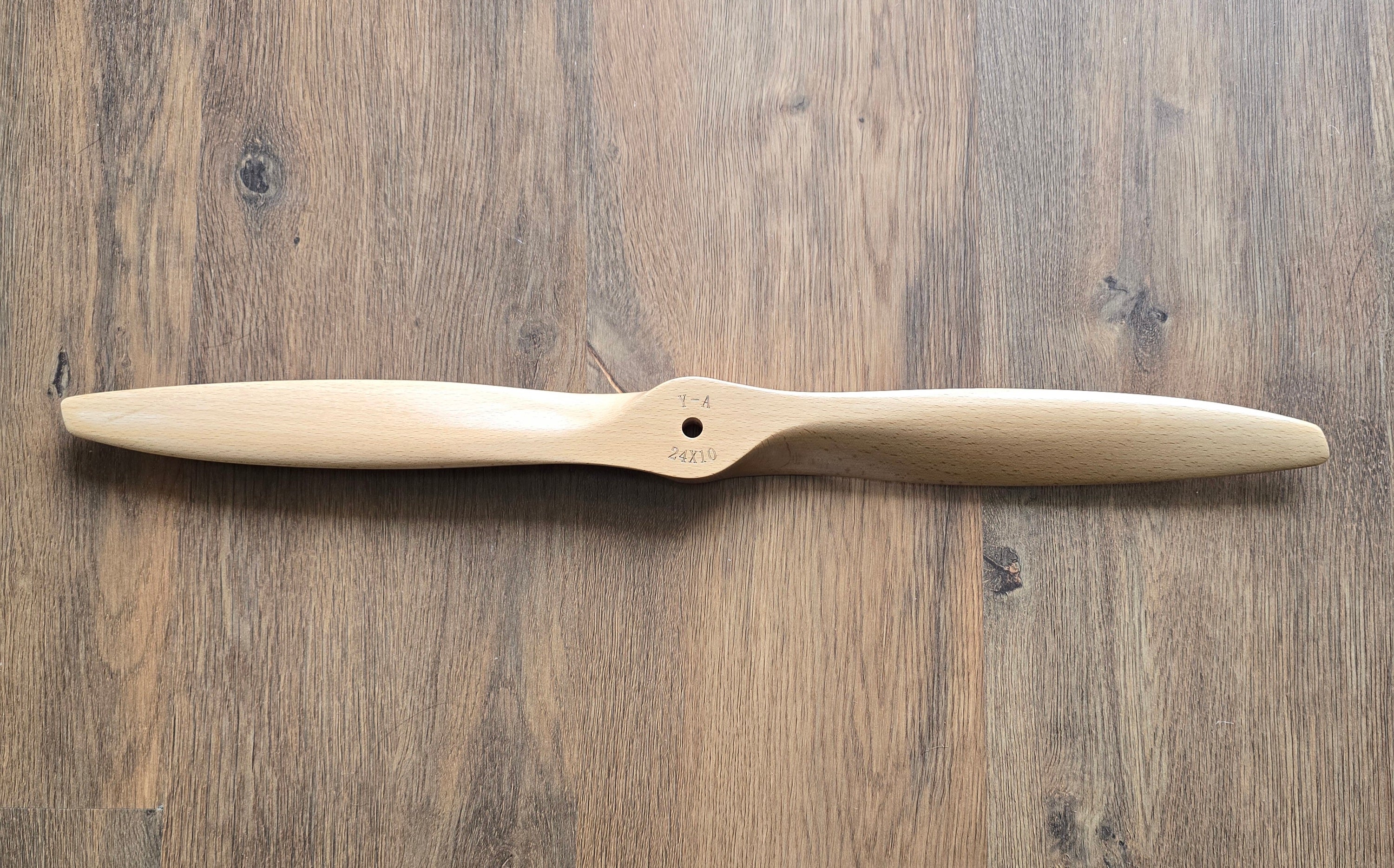 Wooden propeller on a wooden surface