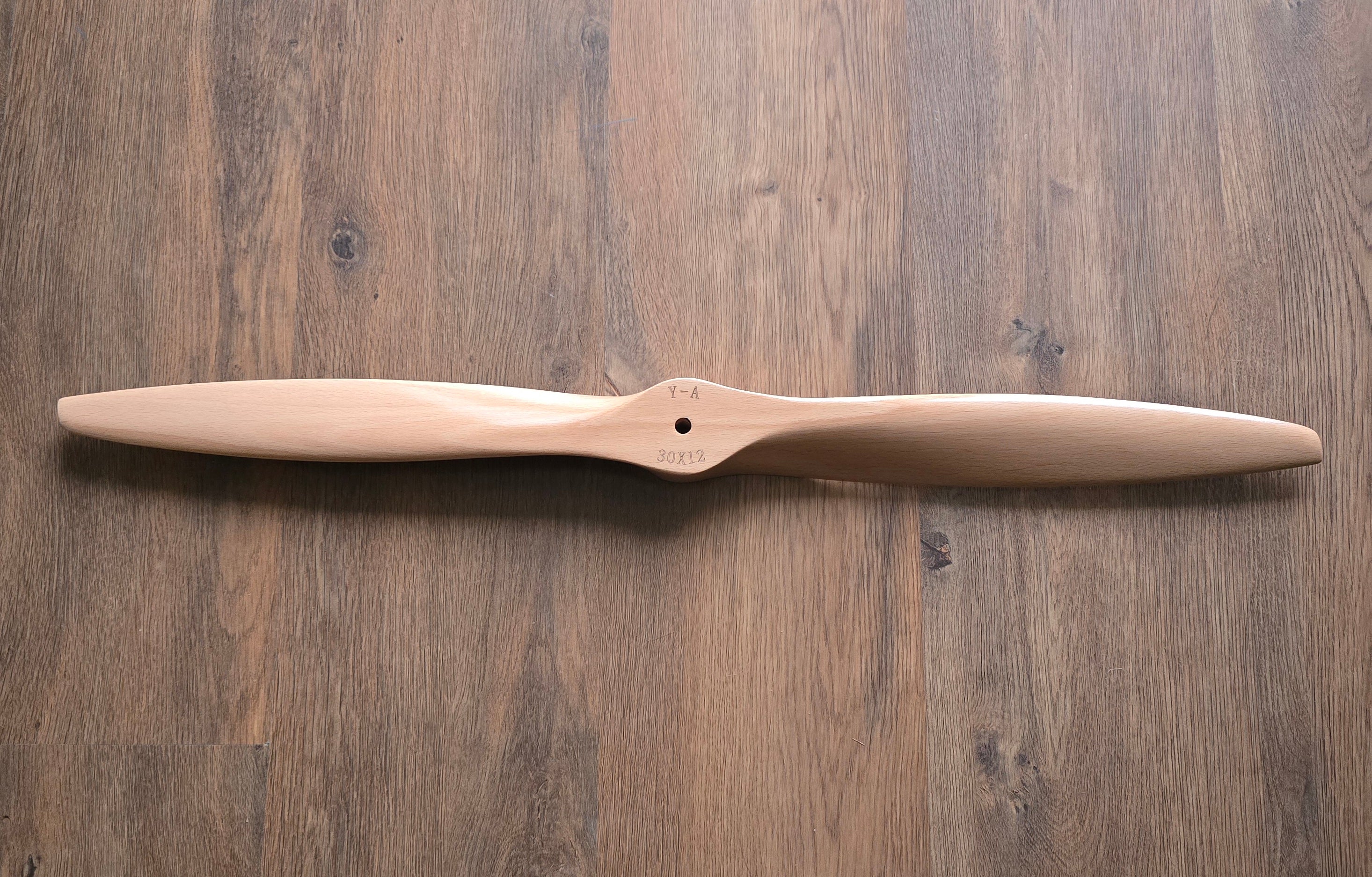 Wooden propeller on a wooden surface