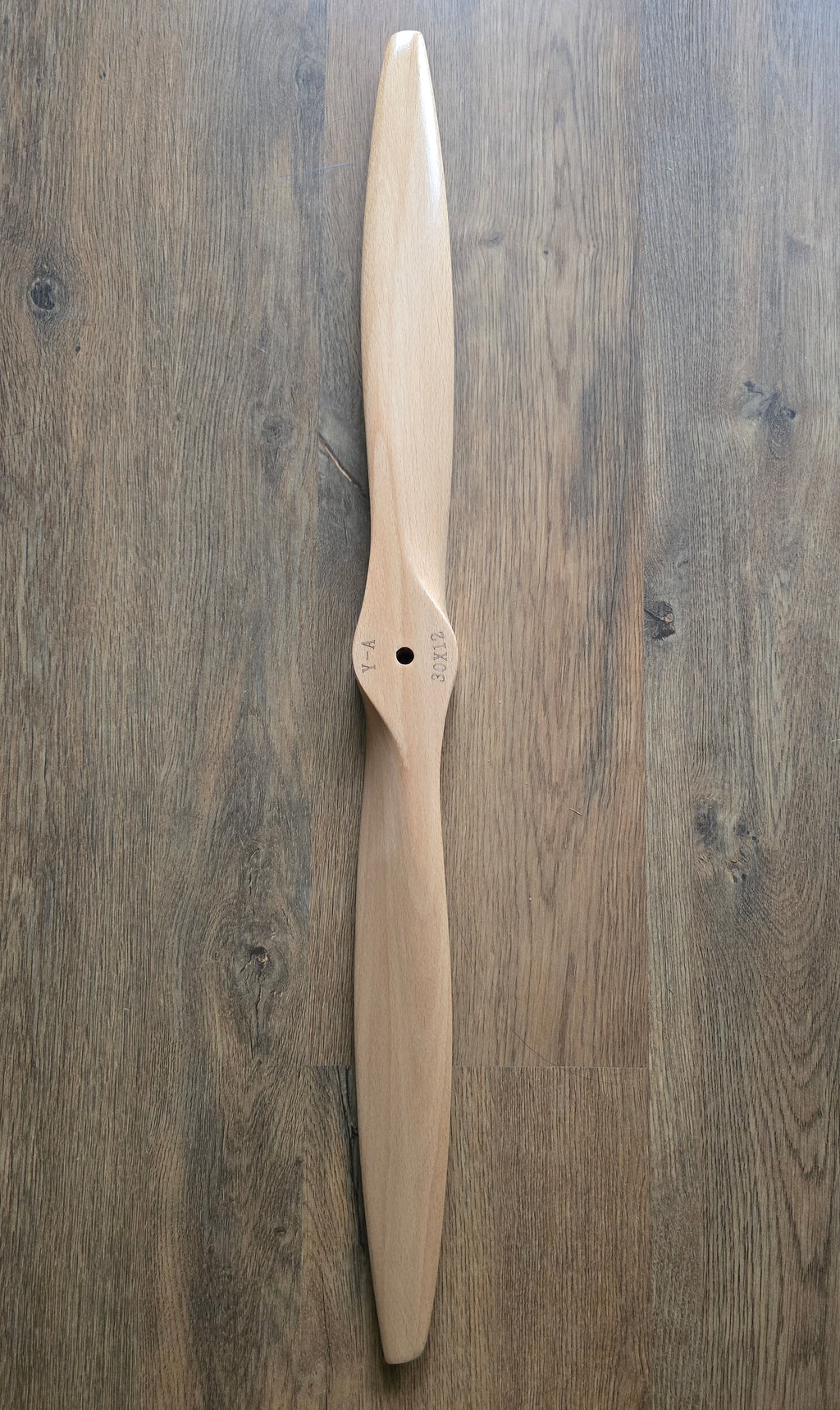 Wooden propeller on a wooden surface