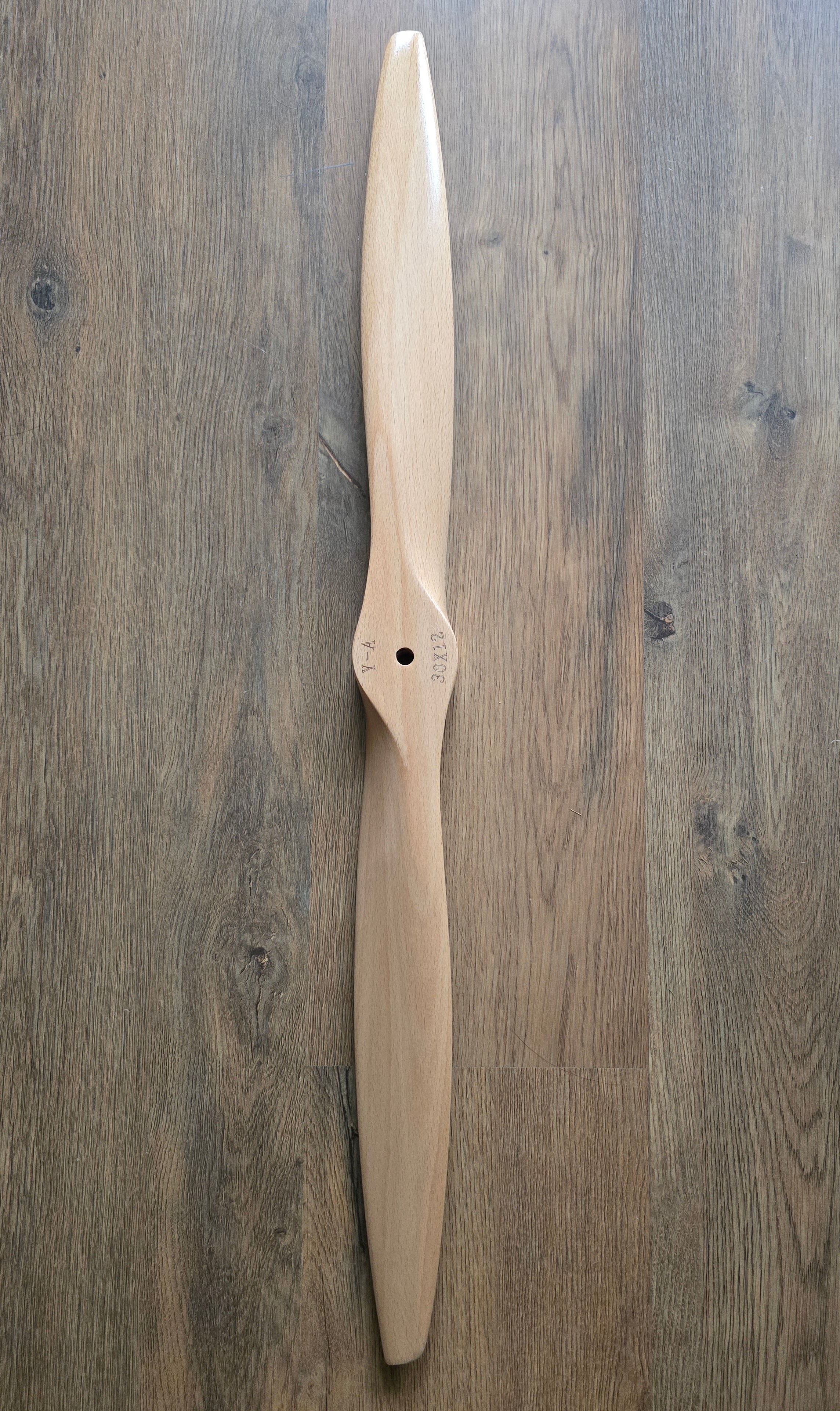 Wooden propeller on a wooden surface